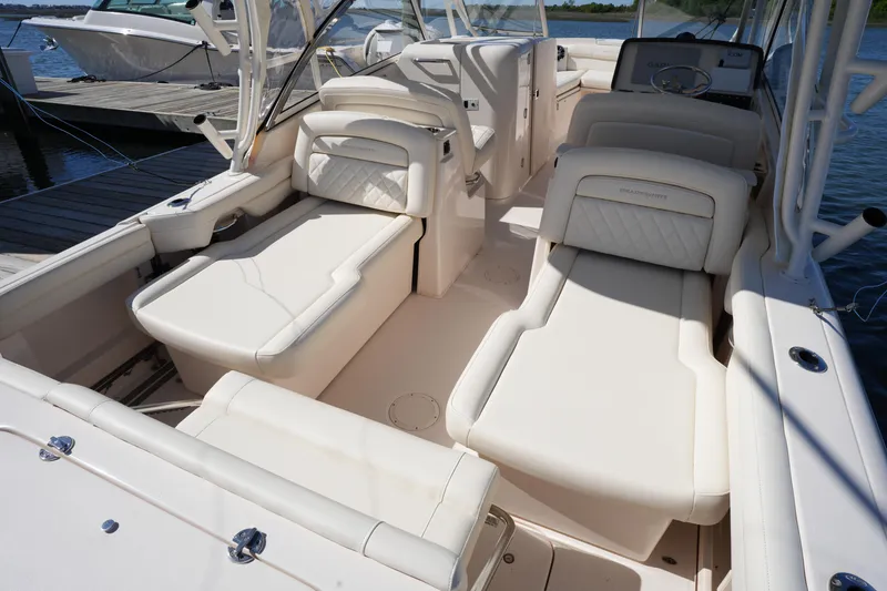 Slide: The Image of 2022 Grady-White Freedom 285 boat interior with luxurious seating and sleek design. - 19