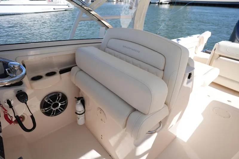 Slide: The Image of 2022 Grady-White Freedom 285 boat interior with plush seating and marine equipment. - 24