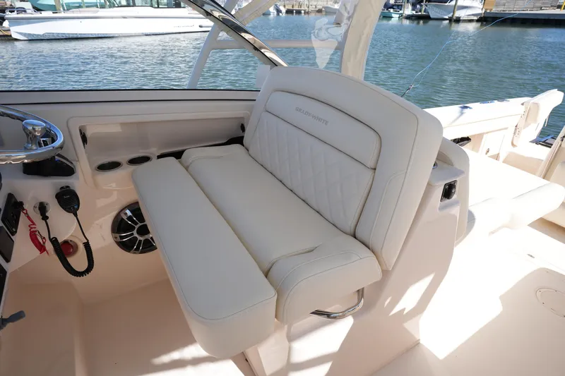 Slide: The Image of 2022 Grady-White Freedom 285 boat interior with luxurious seating and helm controls. - 25