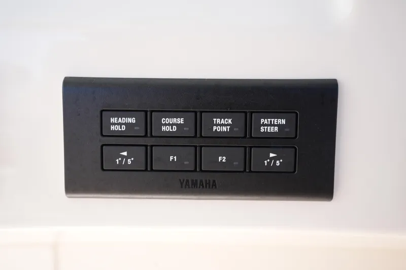 Slide: The Image of Control panel on 2022 Grady-White Freedom 285 boat with Yamaha navigation buttons. - 30