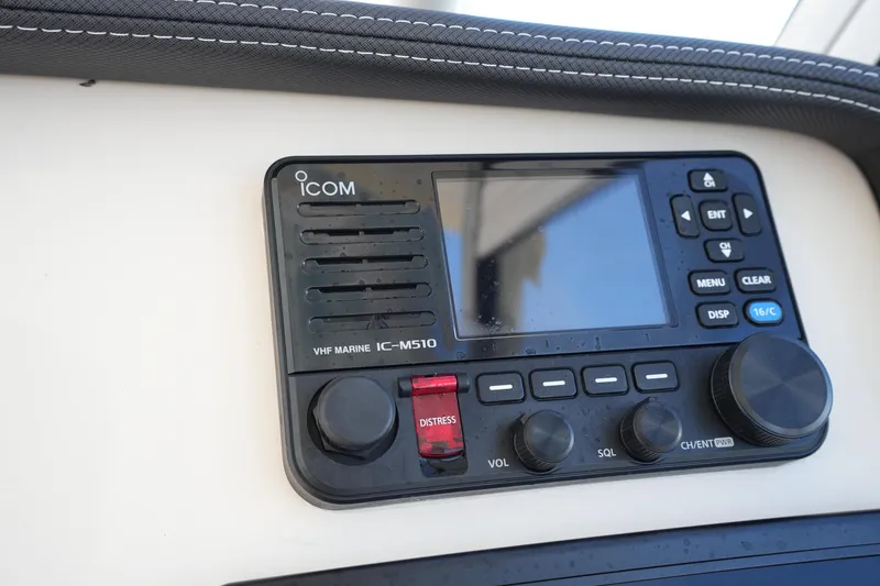 Slide: The Image of VHF marine radio on 2022 Grady-White Freedom 285 boat dashboard. - 37