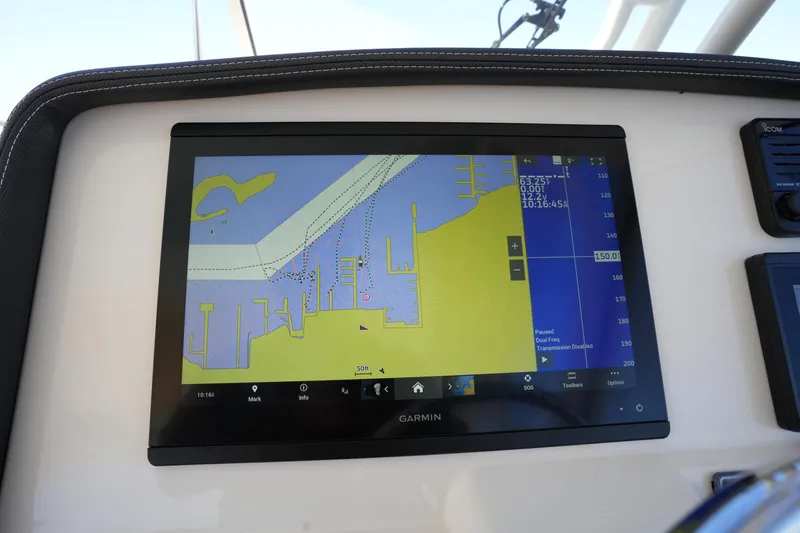 Slide: The Image of Garmin navigation display on 2022 Grady-White Freedom 285 boat dashboard. - 38