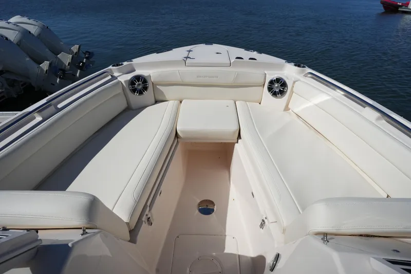Slide: The Image of 2022 Grady-White Freedom 285 boat interior with spacious seating and ocean backdrop. - 42