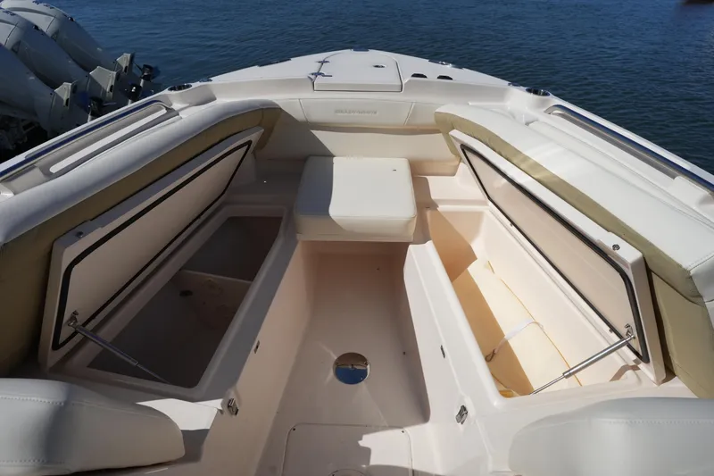 Slide: The Image of 2022 Grady-White Freedom 285 boat interior with open storage compartments. - 43