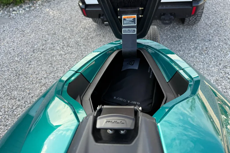 Slide: The Image of Open storage compartment of 2024 Taiga Orca on gravel surface. - 13