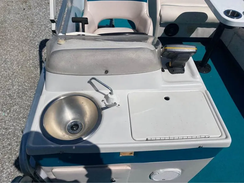 Slide: The Image of 2023 Parti Kraft 240 SC boat interior with sink and seating area. - 7