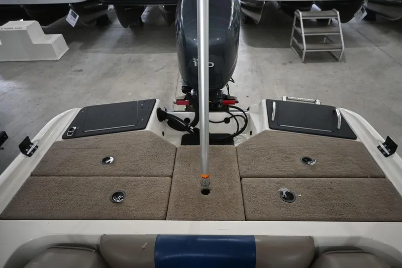 Slide: The Image of 2007 Ranger 180 Reata boat deck with motor and storage compartments. - 10