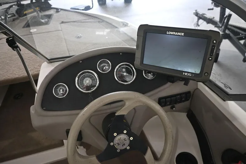 Slide: The Image of Steering console of 2007 Ranger 180 Reata boat with Lowrance HDS display. - 12