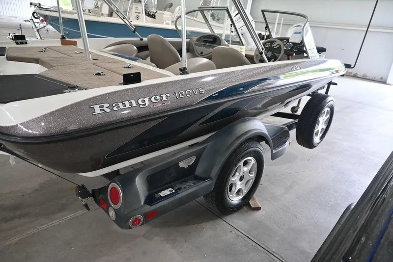 Slide: The Image of 2007 Ranger 180 Reata boat on trailer in a garage setting. - 4