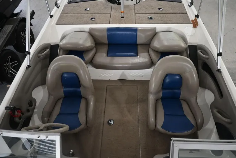 Slide: The Image of 2007 Ranger 180 Reata boat interior with blue and gray seating arrangement. - 8