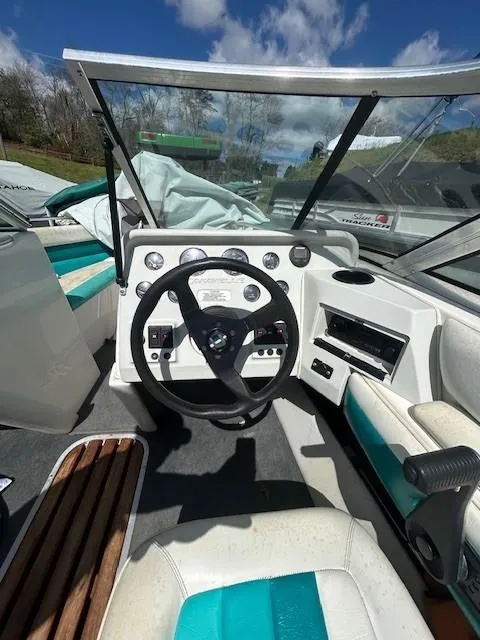 Slide: The Image of Interior of a 1992 Caravelle 2000 boat with steering wheel and dashboard controls. - 7