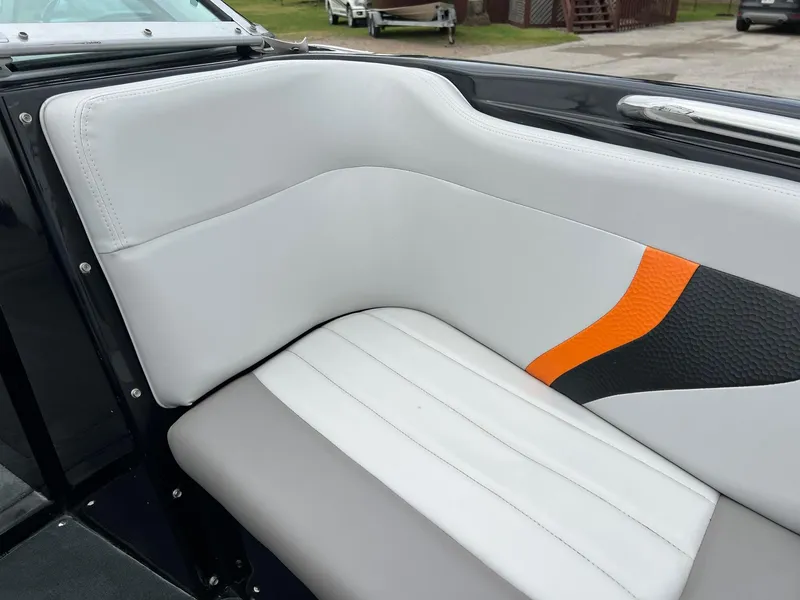 Slide: The Image of 2006 MasterCraft X1 boat interior with white and orange upholstery. - 20