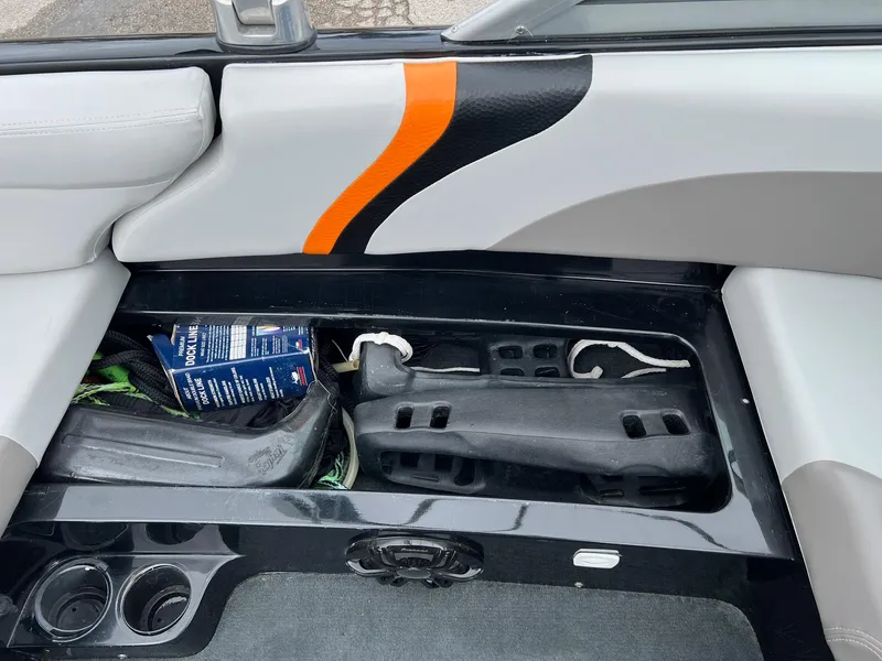 Slide: The Image of 2006 MasterCraft X1 boat interior with storage compartment and colorful upholstery design. - 25