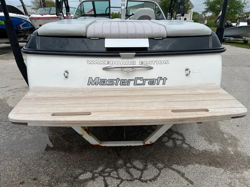 Slide: The Image of 2006 MasterCraft X1 Wakeboard Edition boat rear view with swim platform. - 3