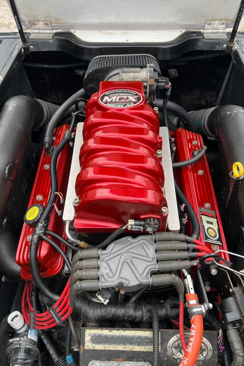 Slide: The Image of 2006 MasterCraft X1 engine with red components and MCX branding. - 30