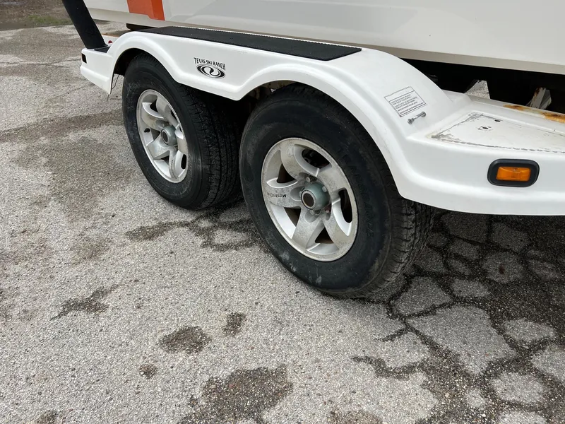 Slide: The Image of 2006 MasterCraft x1 trailer with dual wheels on a paved surface. - 5