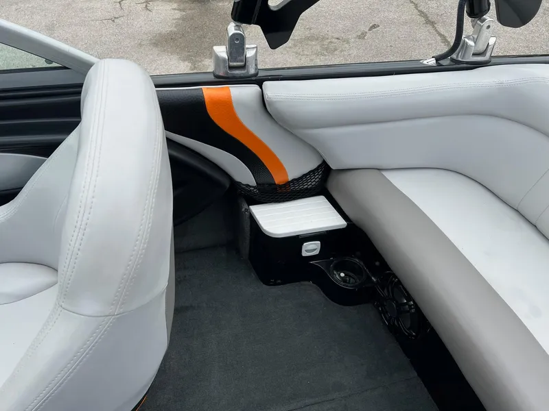 Slide: The Image of 2006 MasterCraft X1 boat interior with white and orange seating. - 9