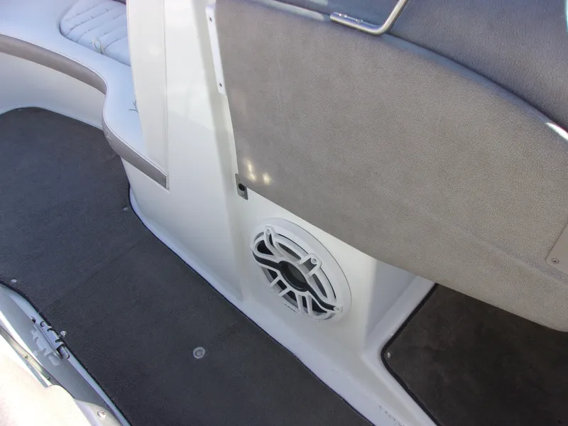 Slide: The Image of 2004 Cobalt 240SD boat interior with speaker and seating area. - 17
