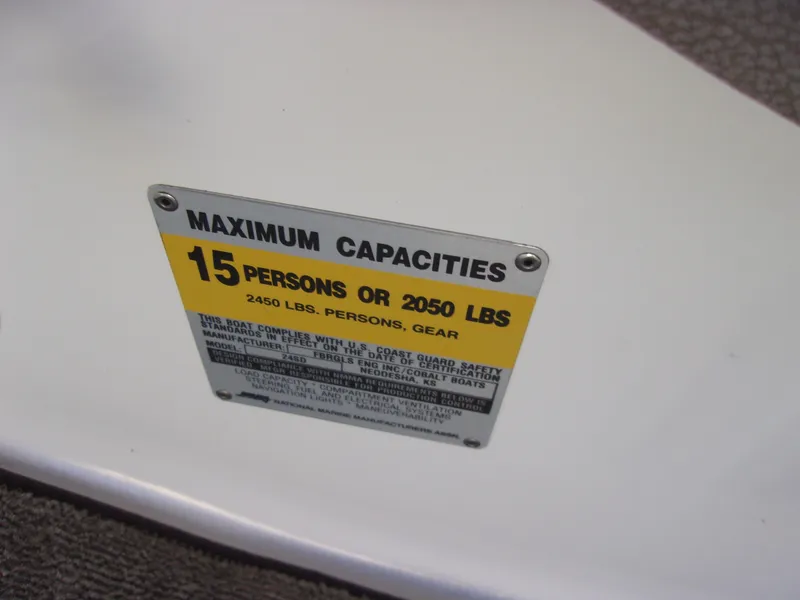 Slide: The Image of 2004 Cobalt 240SD capacity plate: 15 persons or 2050 lbs maximum load. - 19