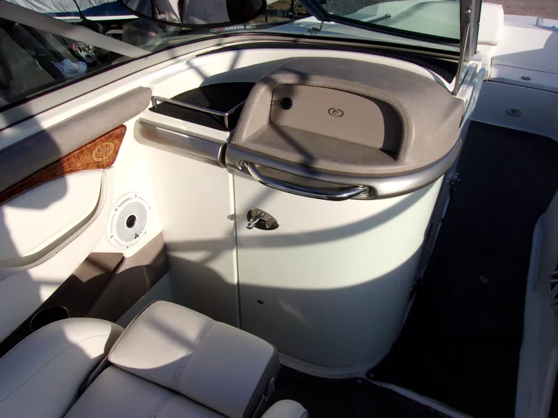 Slide: The Image of 2004 Cobalt 240SD boat interior with seating and storage compartment. - 7