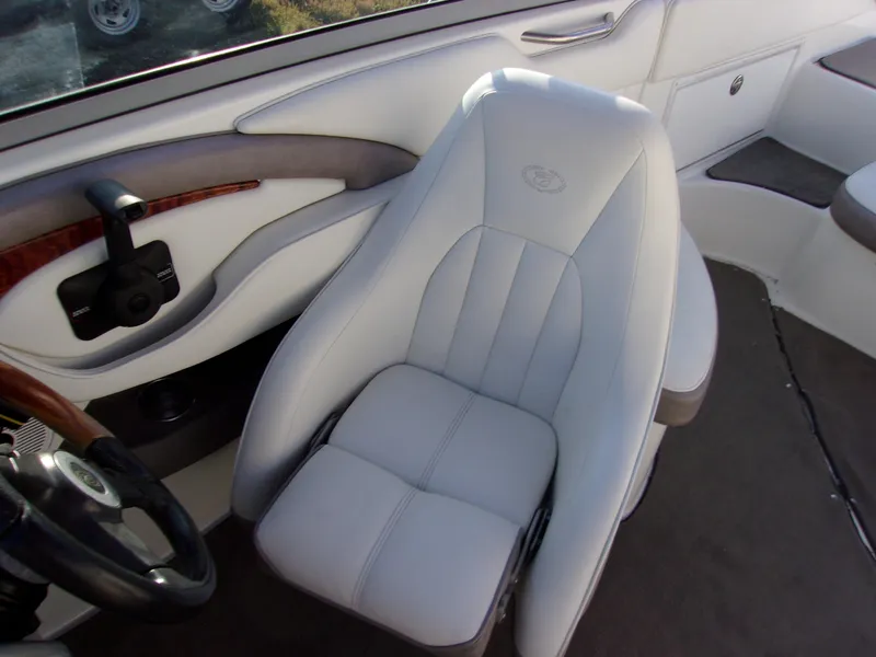 Slide: The Image of 2004 Cobalt 240SD boat interior with white leather seat and steering wheel. - 8
