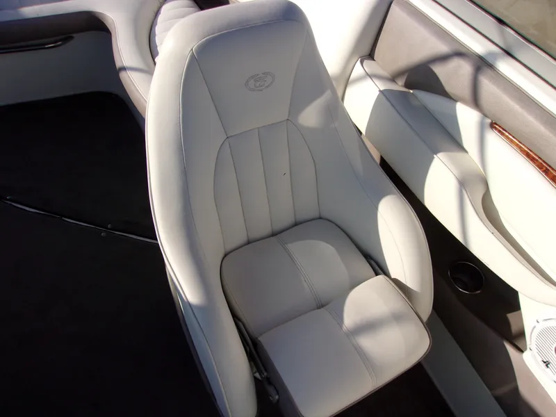Slide: The Image of 2004 Cobalt 240SD boat interior with white leather seating and elegant design. - 9