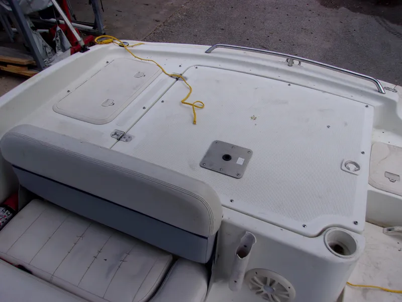 Slide: The Image of 2004 VIP Deckliner 191 boat interior with seating and storage compartments. - 10