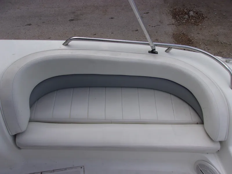 Slide: The Image of 2004 VIP Deckliner 191 boat seat with white and gray upholstery. - 12