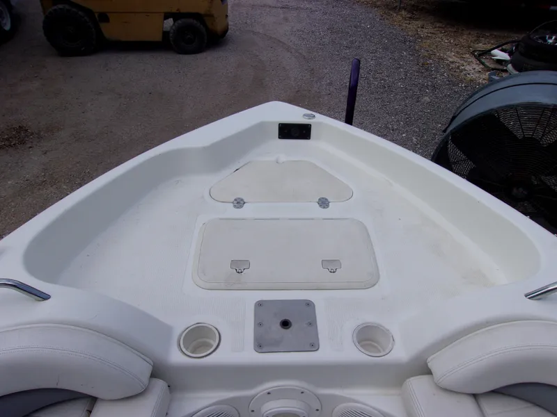 Slide: The Image of 2004 VIP Deckliner 191 boat interior with seating and storage compartments. - 13