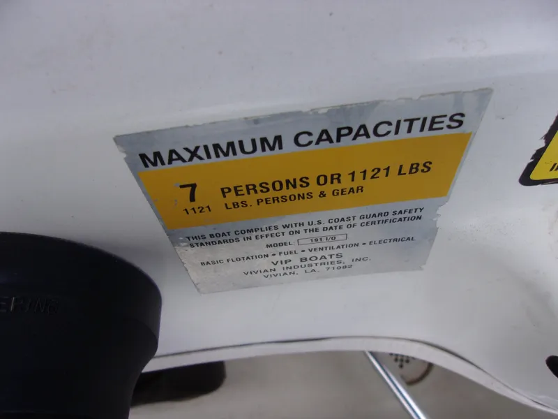 Slide: The Image of 2004 VIP Deckliner 191 capacity label: 7 persons or 1121 lbs, U.S. Coast Guard compliant. - 14