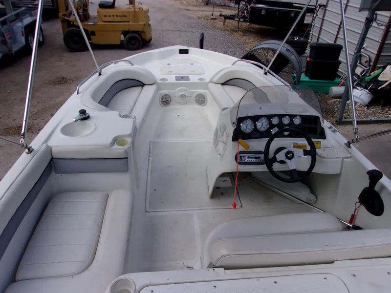 Slide: The Image of 2004 VIP Deckliner 191 boat interior with steering console and seating. - 5