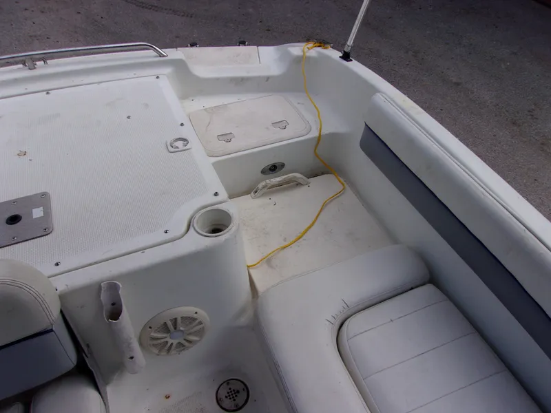 Slide: The Image of 2004 VIP Deckliner 191 boat interior with seating and storage compartments. - 9