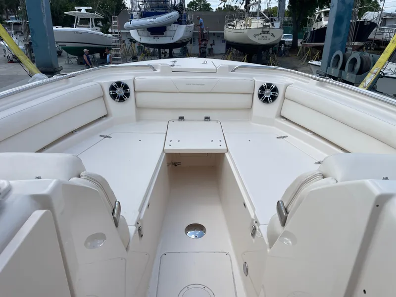 Slide: The Image of 2019 Grady-White Freedom 325 boat interior with spacious seating and modern design. - 13