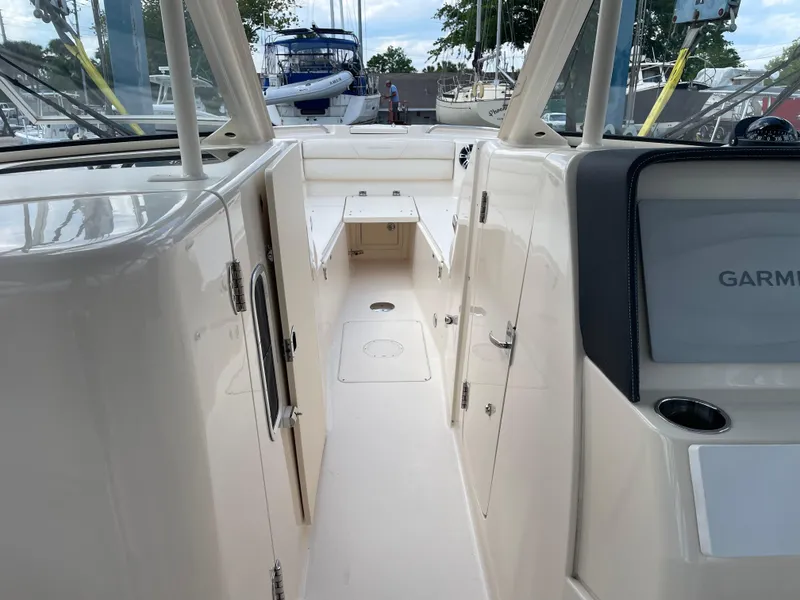 Slide: The Image of 2019 Grady-White Freedom 325 boat interior with Garmin navigation system. - 14
