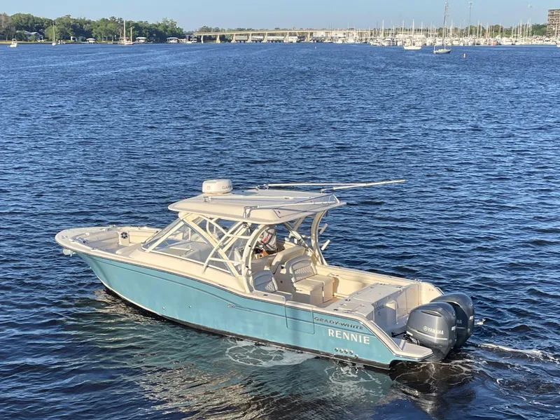 Slide: The Image of 2019 Grady-White Freedom 325 boat cruising on a sunny day in open water. - 3