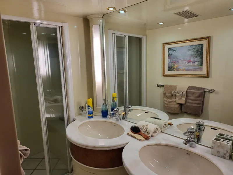 Slide: The Image of Luxurious bathroom in 2000 Horizon 74 Motor Yacht with dual sinks and shower. - 30