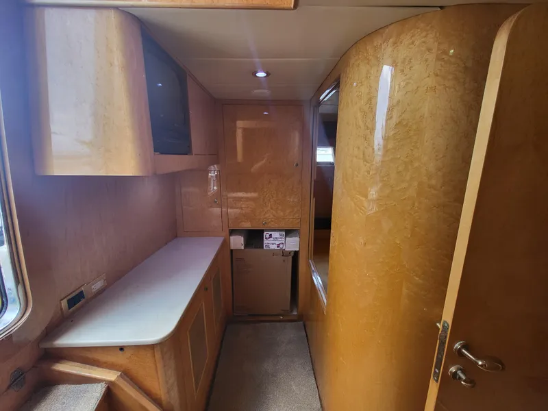 Slide: The Image of Interior of 2000 Horizon 74 Motor Yacht with wood paneling and cabinetry. - 47