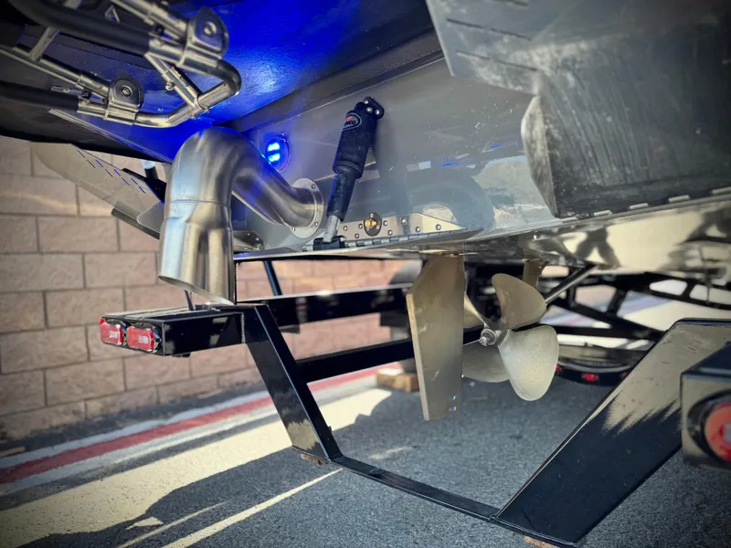 Slide: The Image of 2022 Tigé ATX 24 Type s boat propeller and exhaust detail. - 11