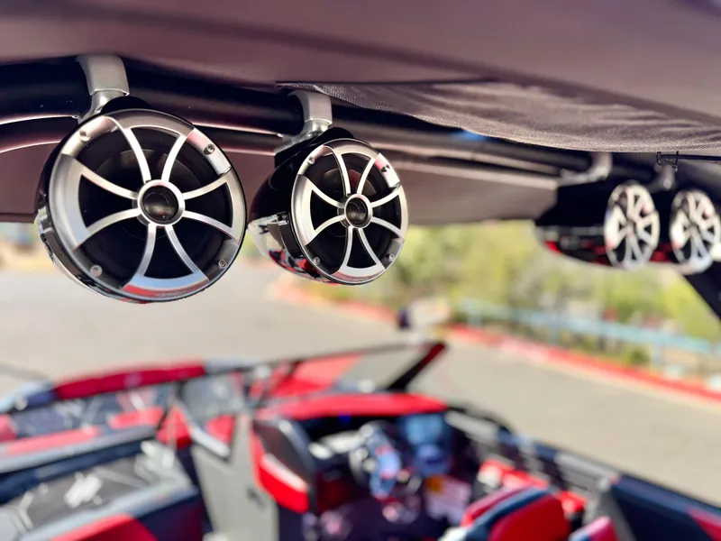 Slide: The Image of 2022 Tigé ATX 24 Type s boat with premium audio speakers, red and black interior. - 16