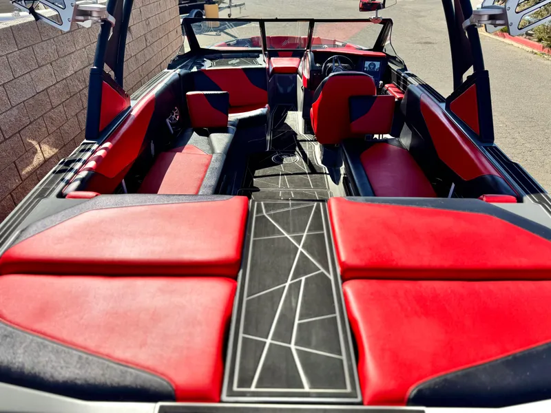 Slide: The Image of 2022 Tigé ATX 24 Type s boat interior with red and black seating. - 18