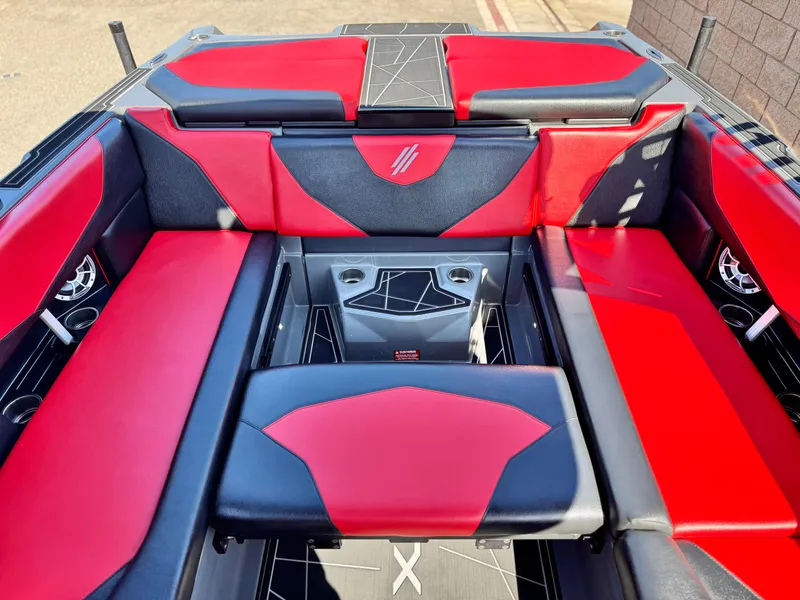 Slide: The Image of 2022 Tigé ATX 24 Type s boat interior with red and black seating. - 25