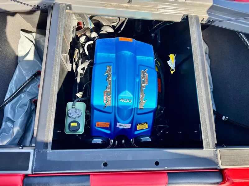 Slide: The Image of 2022 Tigé ATX 24 Type s boat engine compartment with blue cover. - 27