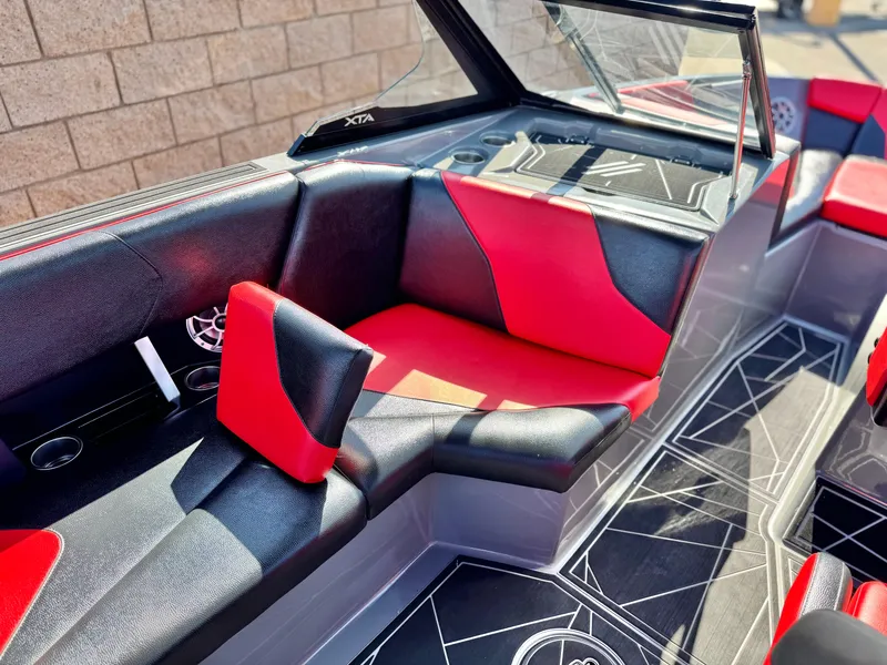 Slide: The Image of 2022 Tigé ATX 24 Type s boat interior with red and black seating. - 29