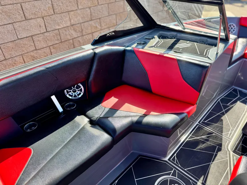 Slide: The Image of 2022 Tigé ATX 24 Type s boat interior with red and black seating, modern design. - 30