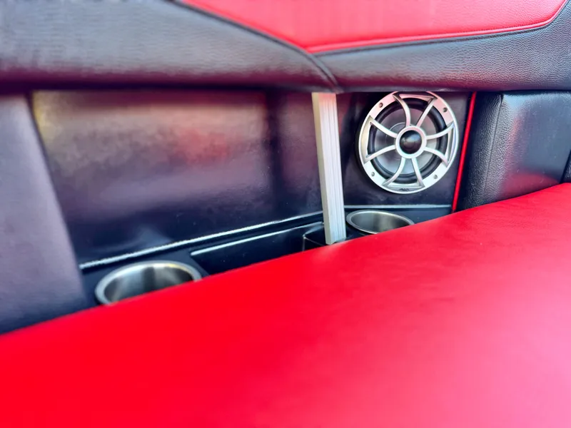 Slide: The Image of Interior of 2022 Tigé ATX 24 Type s with red upholstery and speaker detail. - 33