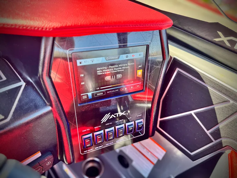 Slide: The Image of 2022 Tigé ATX 24 Type s dashboard with touchscreen and control panel. - 38