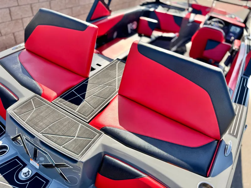 Slide: The Image of 2022 Tigé ATX 24 Type s boat interior with red and black seating. - 8