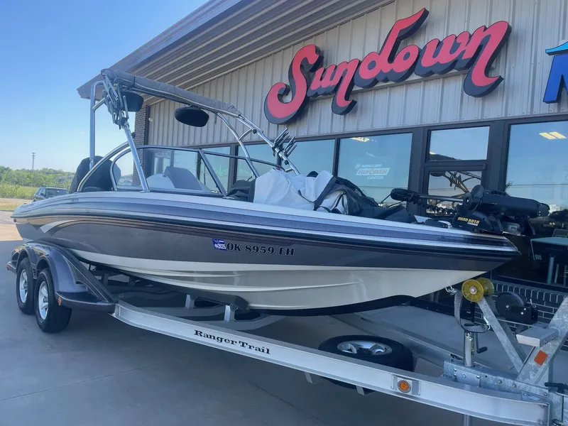 Slide: The Image of 2014 Ranger 211 VS boat on trailer outside Sundown store. - 1