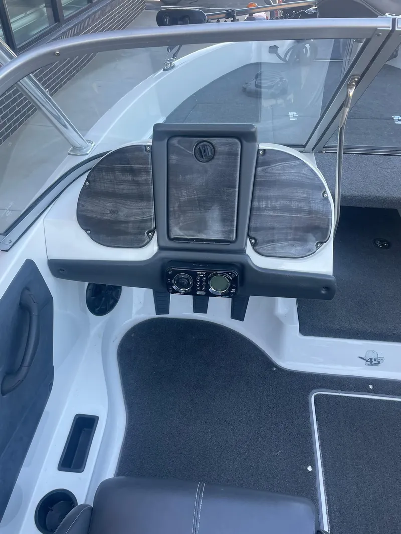 Slide: The Image of 2014 Ranger 211 VS boat dashboard with steering wheel and instrument panel. - 4