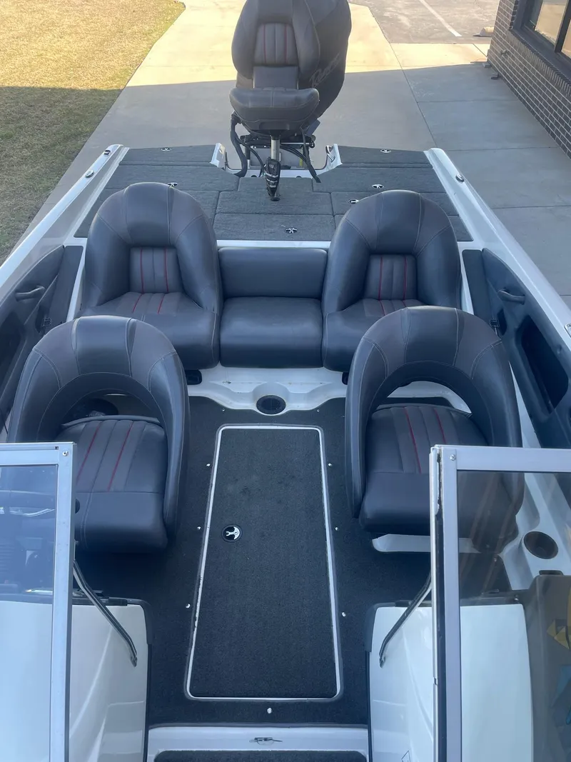 Slide: The Image of 2014 Ranger 211 VS boat interior with four gray seats and a central console. - 6